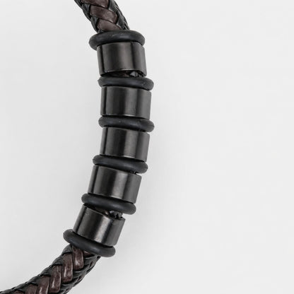 Close-up of engraved beads on bracelet