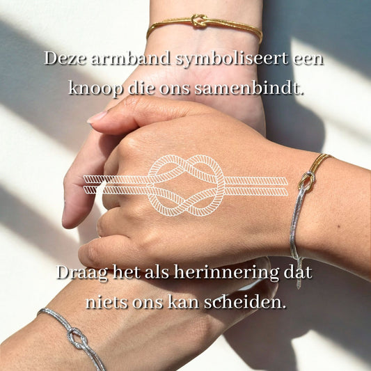 Liefdesknoop armband in goud en zilver